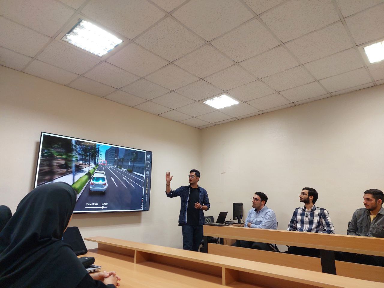 Mr. Hemati presenting the AISL simulator project.